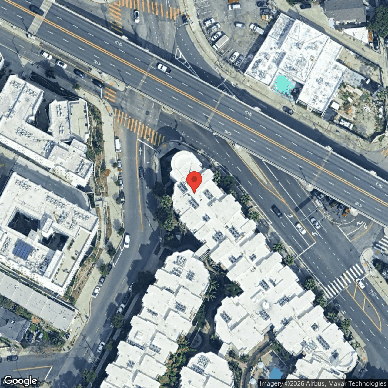 Existing-conditions aerial centered on the Belmont Tunnel portal + Toluca Substation, with the 101 / Glendale Blvd off-ramp wrapping the north edge and the Belmont Station Apartments built directly against the portal on the south side.