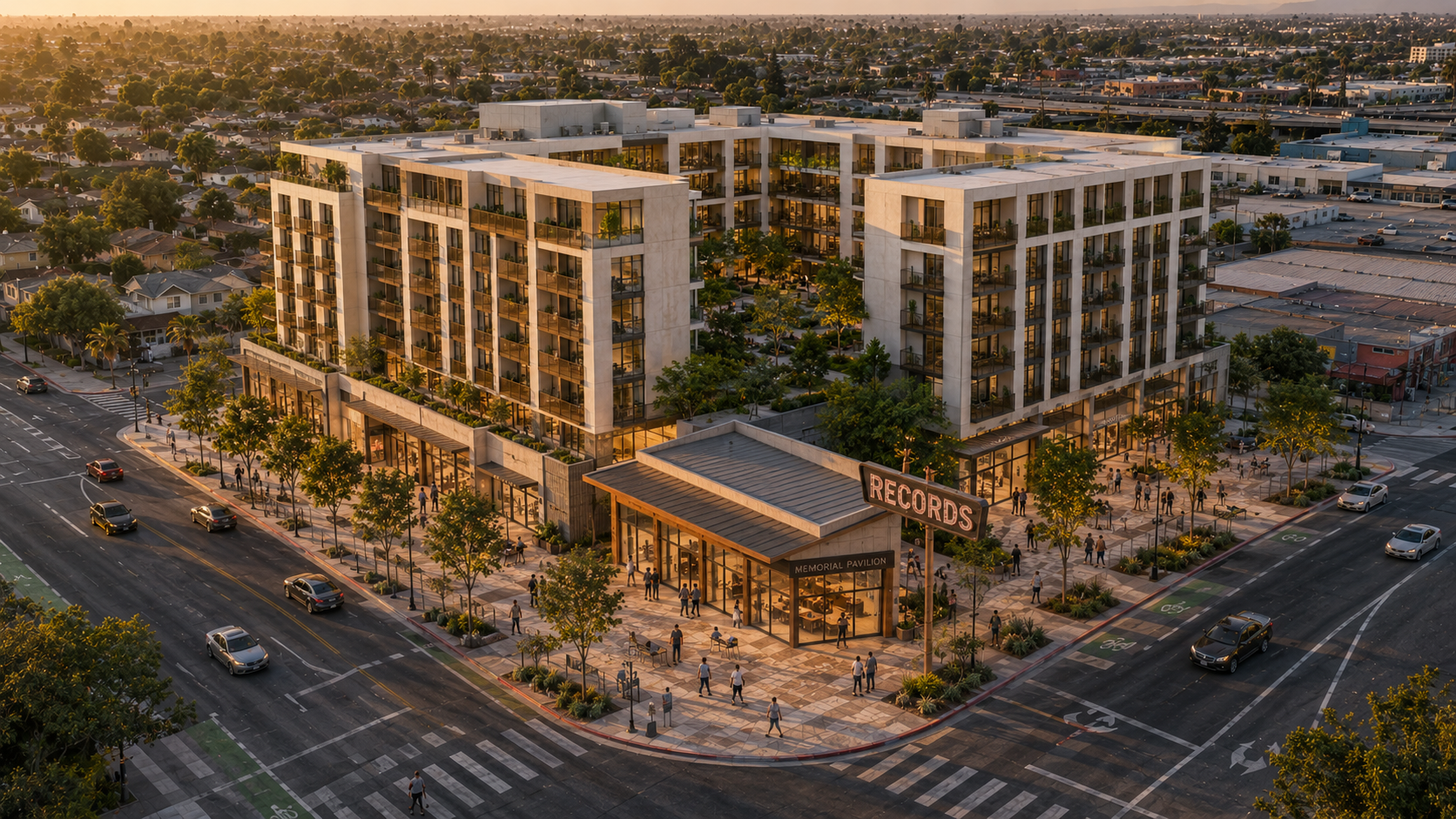 Golden-hour aerial of Alt C: a 5-6 story warm precast concrete mixed-use building covers most of the parcel, with a small architecturally-distinct standalone memorial pavilion at the south corner under a freestanding RECORDS sign mounted on a steel armature in its original geographic location. Pedestrians activate the interpretive plaza around the pavilion; the residential building's planted balconies rise behind.