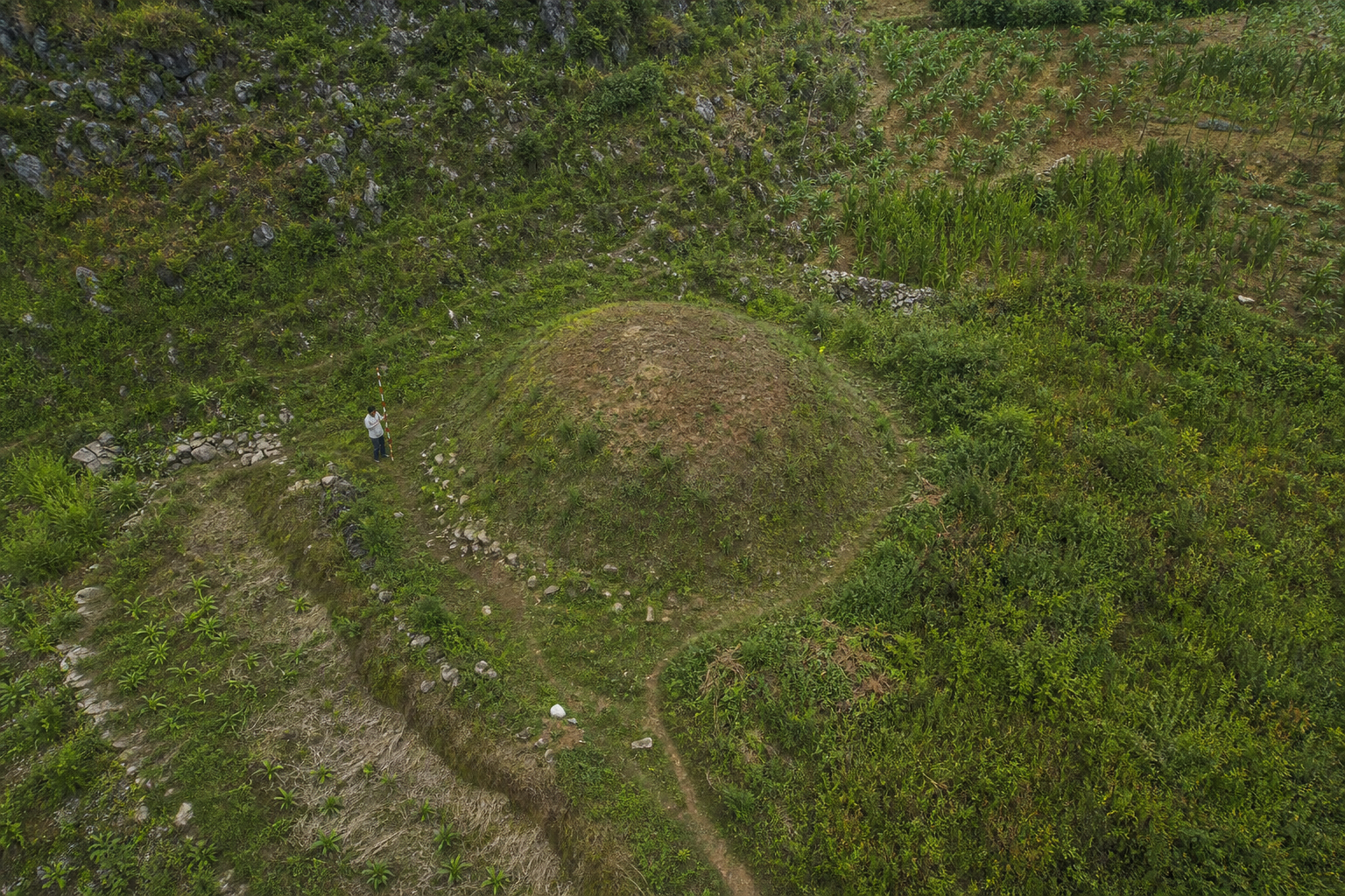 Generated raster terrain reconstruction of a roughly 10 meter earthen pimple or mound feature in karst hillside terrain